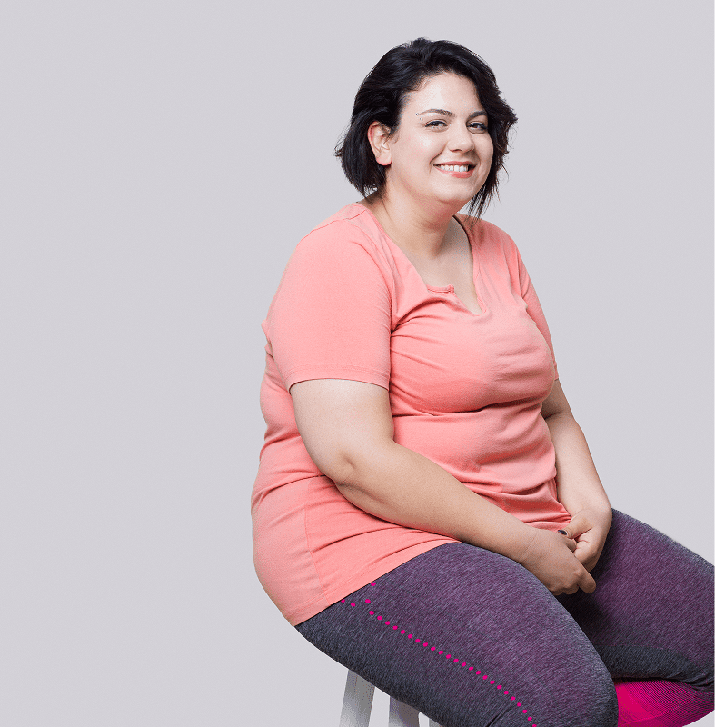 Woman in pink shirt, gray leggings