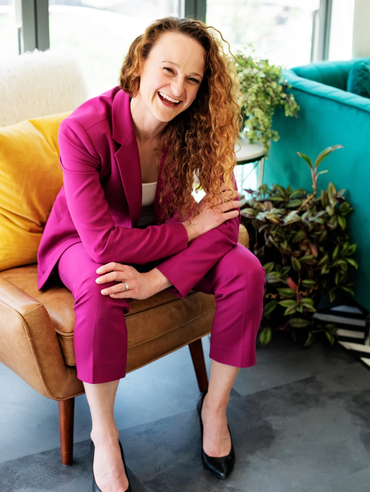 Woman smiling in pink suit